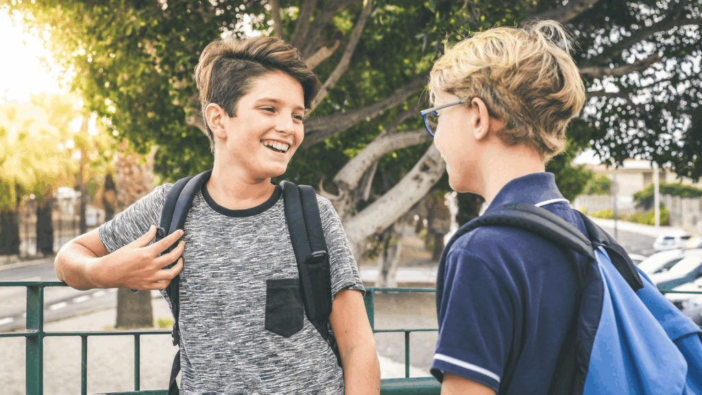 Two Boys Laughing While saying sped each other.
