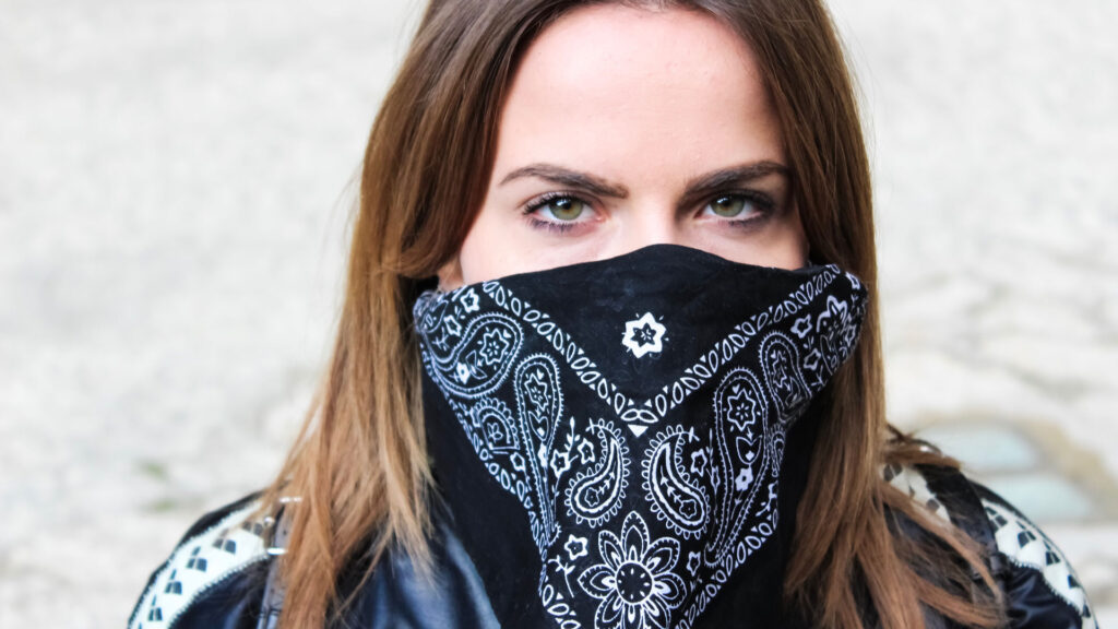 Woman wearing black bandana.