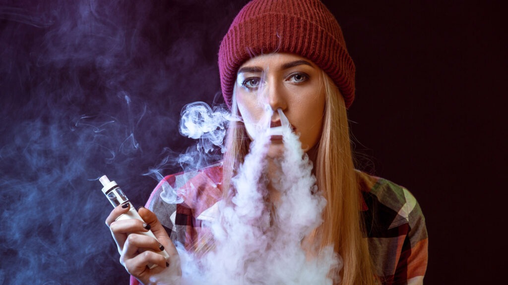 Young Girl Smoking Vape.